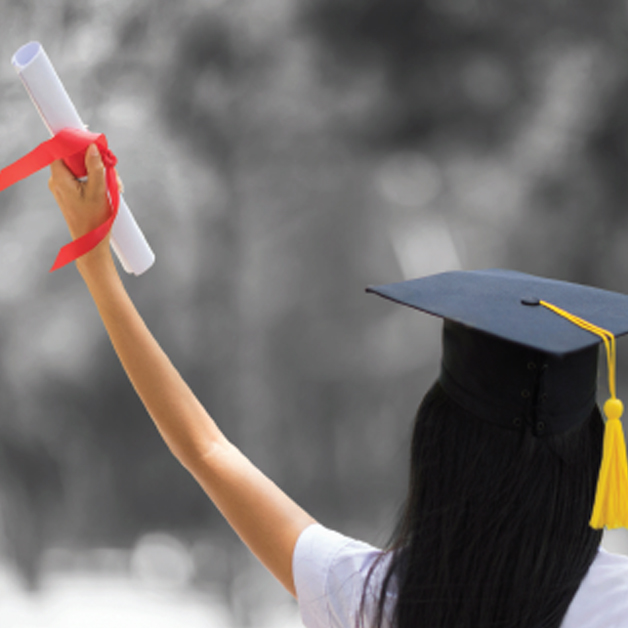 high school grad holding diploma