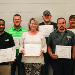 front row, from left, Anthony Talley (10 years of service), Paula May (15 years of service), Tanner Hicks (5 years of service) and Ben Shadrick (15 years of service). Back row, from left, Matt Phillips (20 years of service), Brent Loftin (20 years of service), Shannon Anthony (15 years of service) and Tim Reeves (5 years of service). Not pictured: Brannon Horne (10 years of service), Jamin Blair (15 years of service), Jimmy Hutto and Bubba Allen (20 years of service).