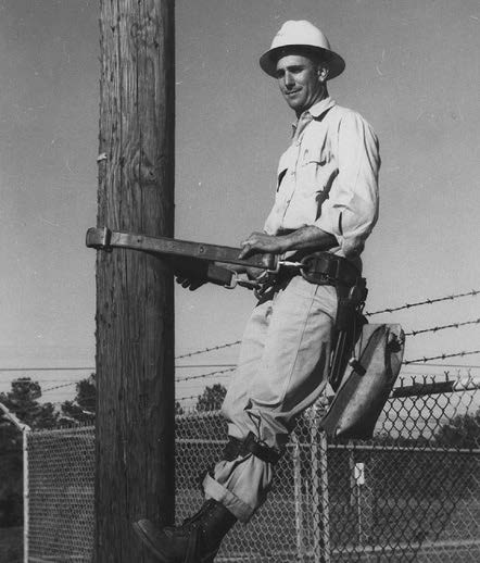 Lineman Val Pruitt climbing pole