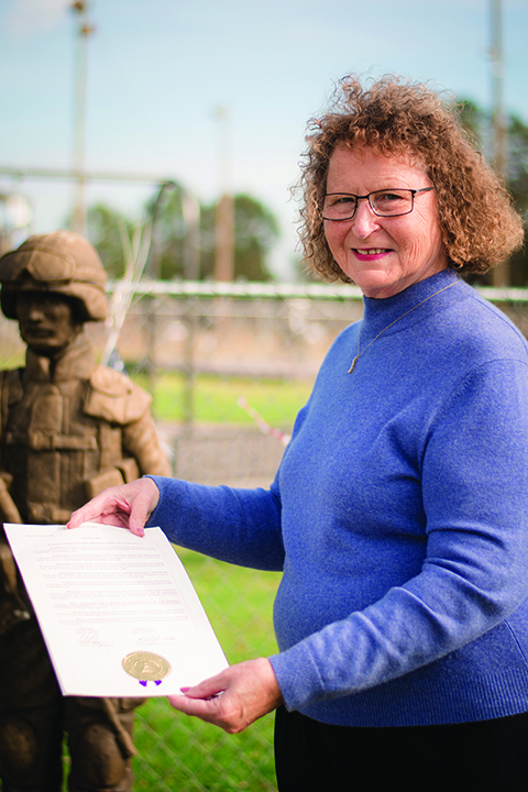 Diverse Power Board Member and DAR Regent Cheryl Meadows proudly displays the newly awarded proclamation.