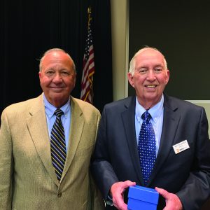 Roy Tollerson holding distinguished cooperator award