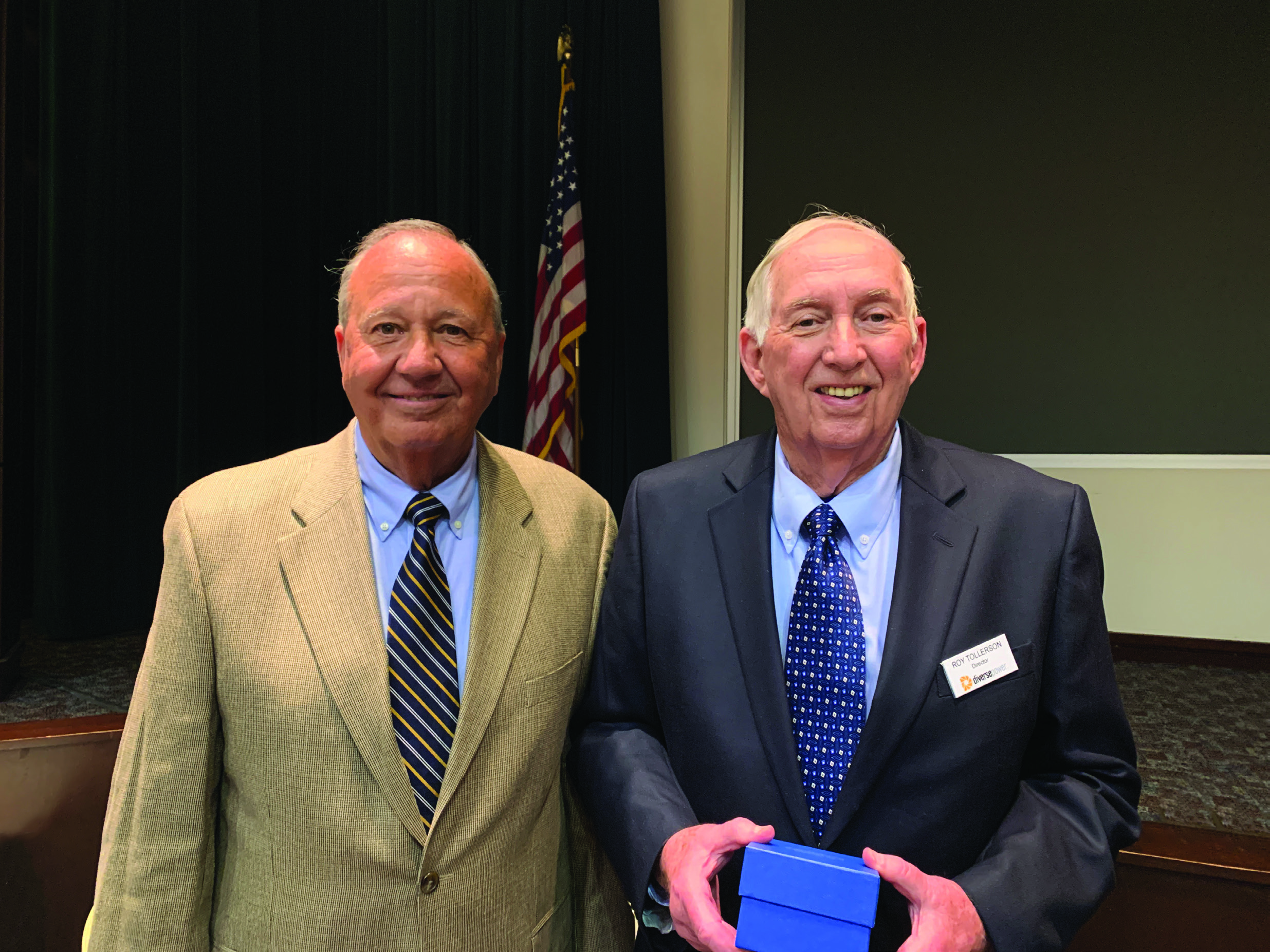 Roy Tollerson holding distinguished cooperator award